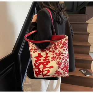 Detail view of ethnic Chinese wedding tote bag with red Double Happiness floral print