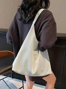 Minimalist white hobo tote bag for women showing a spacious and slouchy shoulder design