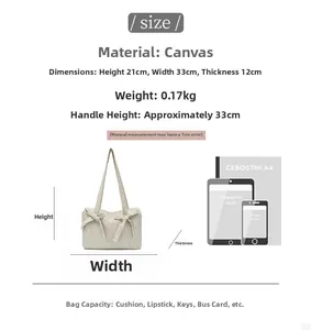 Detailed size specifications for beige canvas tote bag with bow and 33cm handle height