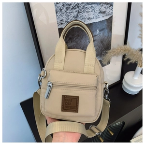 Detail of waterproof nylon crossbody bag with adjustable strap and brand logo patch