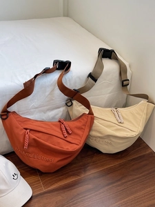 Large capacity canvas half moon crossbody bag in beige and rust colors for daily use