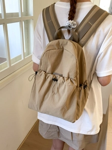 Large khaki nylon backpack for women with drawstring pocket and wide shoulder straps