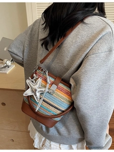 Rainbow woven bucket bag with brown leather trim and silver starfish charm accessory