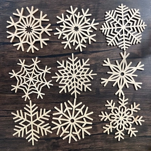 Macro detail of laser-cut wooden snowflake coasters with intricate geometric patterns