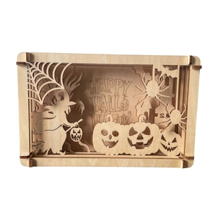3D laser-cut wooden Halloween pumpkin frame with witch and spider patterns