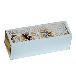 Detail of light blue laser-cut candy box with hollow butterfly pattern and floral design
