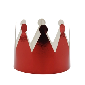 Macro detail of glossy red metallic crown napkin ring with festive serrated edges