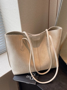 Minimalist beige tote bag with natural leather texture for women, high-capacity shoulder bag