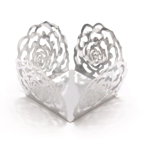 Macro shot of silver laser-cut floral candy holder for wedding and party cupcake decoration