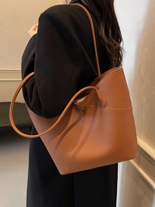 Brown lychee leather tote bag with large capacity and shoulder straps for daily use