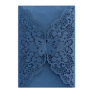 Navy blue laser cut lace invitation cover with glitter finish and butterfly buckle