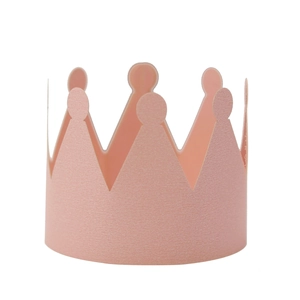 Detail of light pink paper crown napkin ring for birthday party and celebration
