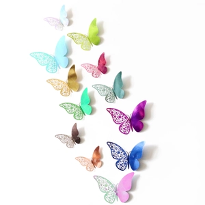 Macro view of 3D mirror butterfly wall stickers with colorful laser hollow designs