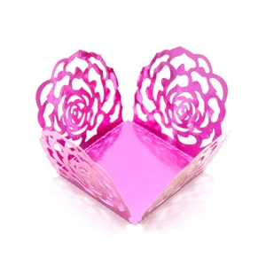 Pink laser-cut cupcake wrappers with elegant rose patterns for wedding parties