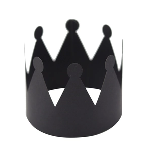 Detail of matte black paper crown party favors for birthdays and celebrations