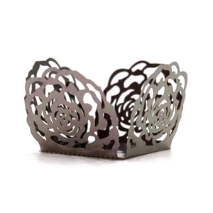 Detailed laser-cut rose pattern on taupe pearlescent paper cake wrapper for weddings
