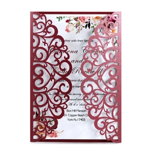 Laser cut burgundy wedding invitation with floral inner card and vine pattern cover