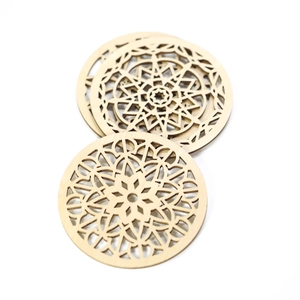 Laser-cut wooden coasters with intricate mandala patterns for table heat protection