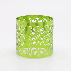 Detailed view of the emerald green laser-cut geometric napkin ring with metallic finish