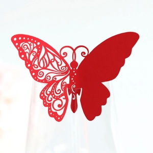 Detail of red butterfly wine glass card with intricate laser-cut hollow vine pattern