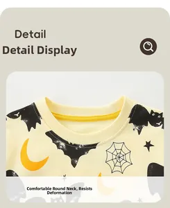 Close-up of ribbed round neckline and Halloween cartoon prints on boys sweatshirt