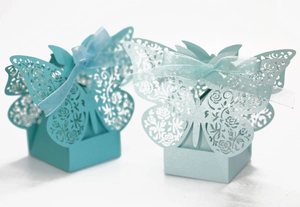 Detailed laser-cut butterfly gift boxes with pearlescent finish and ribbon bows