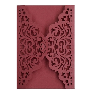 Elegant laser-cut dark red wedding invitation cover with ornate European floral patterns
