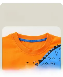 Detail view of reinforced ribbed neckline on orange cotton long sleeve kids t-shirt