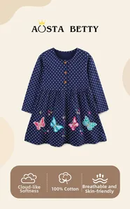 Detail of 100% cotton navy blue girls dress with butterfly embroidery and soft texture