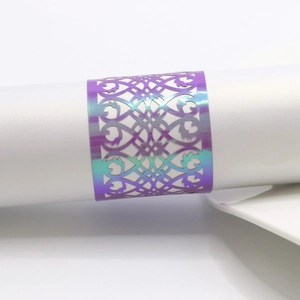 Macro detail of laser-cut hollow napkin ring with holographic gradient finish