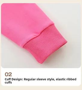 Detail of pink sweatshirt featuring elastic ribbed cuffs and high-quality knitted cotton fabric