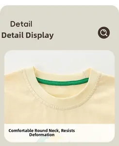 Detail of comfortable cotton ribbed crew neck with green inner lining for kids T-shirt