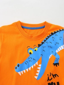 Vibrant orange cotton boys long sleeve t-shirt featuring a cartoon crocodile graphic