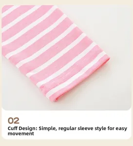 Détail de la manche d'une robe rayée rose et blanc avec ourlet à double couture