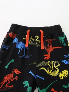 Pantalon de jogging enfant noir avec imprimé dinosaure et cordon orange vif