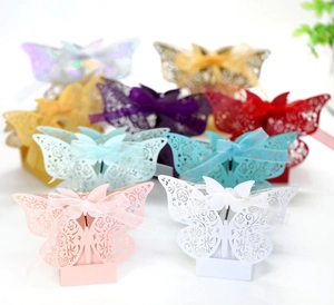 Detailed laser-cut wedding favor box featuring rose hollow butterfly and silk ribbon bow