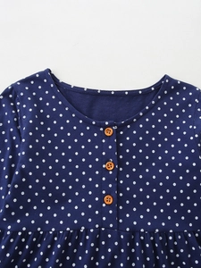 Fashionable navy blue polka dot dress for girls with bright orange buttons and round neck