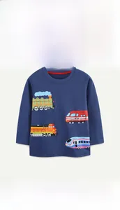 Close-up of boys long sleeve cotton shirt featuring colorful cartoon train prints