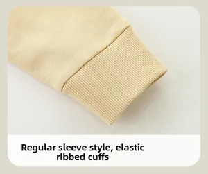 Detail of ribbed cuffs on beige knit cotton sweatshirt with elastic texture design