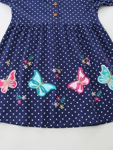 Girls' navy blue polka dot cotton dress featuring exquisite butterfly and floral embroidery