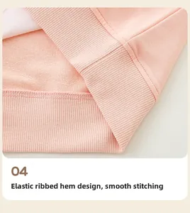 Detail of ribbed hem and neat stitching on light pink soft cotton girl sweatshirt