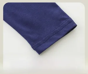 Detailed close-up of navy blue cotton knit sweatshirt cuffs with neat double-stitched seams