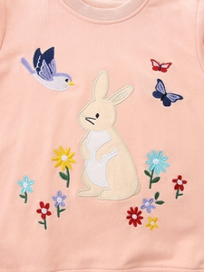 Girl's pink cotton sweatshirt featuring detailed rabbit and floral embroidery