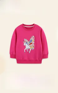 Detail of unicorn and floral embroidery on a 100% cotton rose red kids sweatshirt