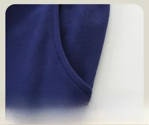 Detailed view of side pocket stitching and knit fabric on kids' navy joggers