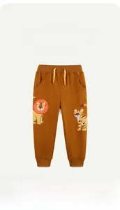 Detail of caramel kids sweatpants with cute lion and tiger cartoon embroidery and drawstring