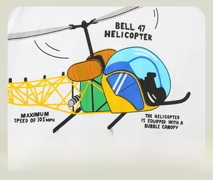 Detail shot of the cartoon Bell 47 helicopter print on a white cotton boy's long sleeve tee