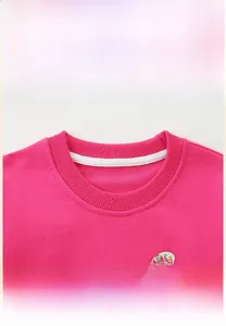 Detail of girls' sweatshirt ribbed crew neck with high-quality stitching and tape seam