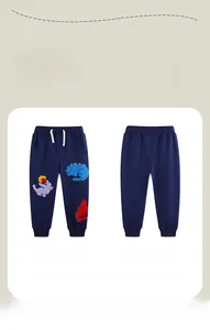 Detail of navy blue boys joggers with cartoon dinosaur embroidery and elastic drawstring waist