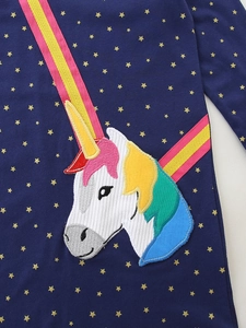 Navy blue girls dress with gold star patterns and a colorful unicorn embroidery detail